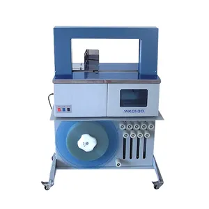 Automatic banding machine with under tape roll