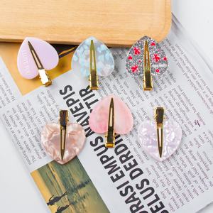 Kinling OEM elegante nuevo diseño de forma de amor 5cm Color cálido letra LOGO impresión PVC para ocasiones de fiesta pinzas para el cabello sin costuras - Product Image 1