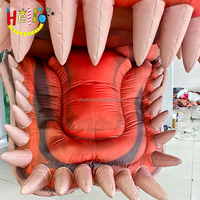 Tête de dinosaure gonflable à décor mural personnalisé avec bouche ouverte et dents pointues