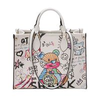 Nouveau Sac Fourre-tout Décontracté en PU 2025 pour Femme, Motif Ours de Dessin Animé, Couleurs Distinctives, Graffiti, Fermeture Éclair et Ouverte