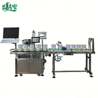 Machine de marquage laser dédiée aux boîtes de lait en poudre intégrant le codage haute vitesse, la vérification visuelle et le tri automatique des articles défectueux