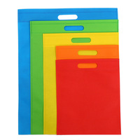 Op maat gemaakte bedrukte logo's, warmtegeperste, niet-geweven, platte, geperforeerde handtas, kleding- en boodschappentas
