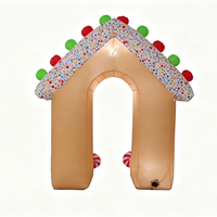 Arche gonflable en forme de maison de pain d'épices de Noël avec des bâtons de sucre et des sucettes pour la décoration d'entrée d'événements festifs