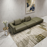 Canapé modulaire en cuir capitonné vert olive confortable avec sièges réglables pour un espace de vie moderne