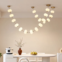 Luminaire suspendu linéaire en forme de boule d'albâtre naturel de luxe, cadre en laiton, pour salle à manger, villa, comptoir de bar, décoration