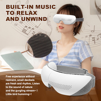Masseur oculaire Bluetooth vibrant pliable personnalisé en usine avec fenêtre de vision, thérapie thermique et massage par airbag pour soulager les yeux