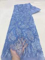 Tissu de dentelle de luxe brodé de perles et de sequins à motifs floraux pour vêtements de mariée