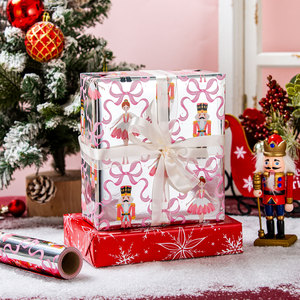 Papier cadeau métallique de Noël avec motif casse-noisette et ballerine, nœuds roses et finition argentée pour emballages de fêtes - Product Image 1