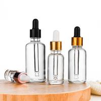 Vente en gros d'usine, flacon compte-gouttes en verre transparent personnalisé de luxe pour huile essentielle de fleurs, avec bouchon compte-gouttes