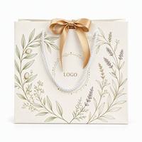Sac en papier de luxe fait main avec logo estampé à chaud en feuille d'or et corde en coton, petit sac cadeau personnalisé pour rouges à lèvres, vente en gros