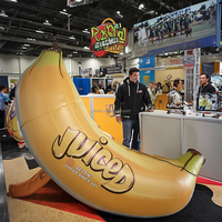 Support à jus accessoires de décoration modèle de fruit banane géante jaune gonflable avec logo