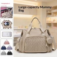 Sac à dos multifonctionnel transfrontalier pour maman et bébé, grande capacité, tendance, en tissu Oxford beige, à suspendre à la poussette