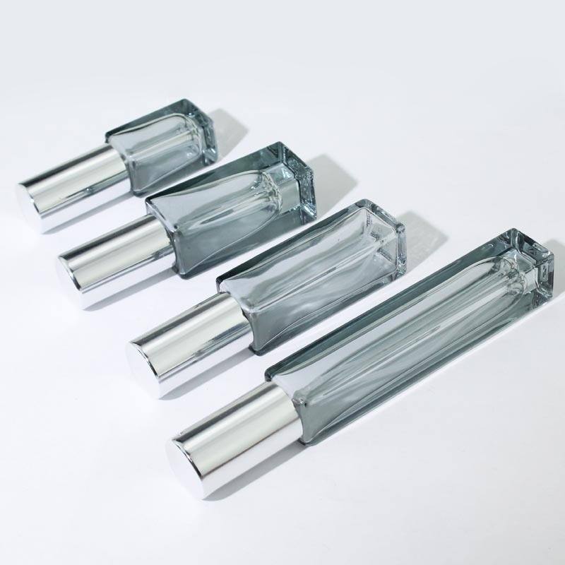 gray bottle with silver sprayer