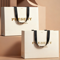 Sacs en papier de luxe pour la vente au détail de vêtements, de cadeaux, de bijoux, avec poignée, personnalisés avec le logo de la marque, pour la promotion