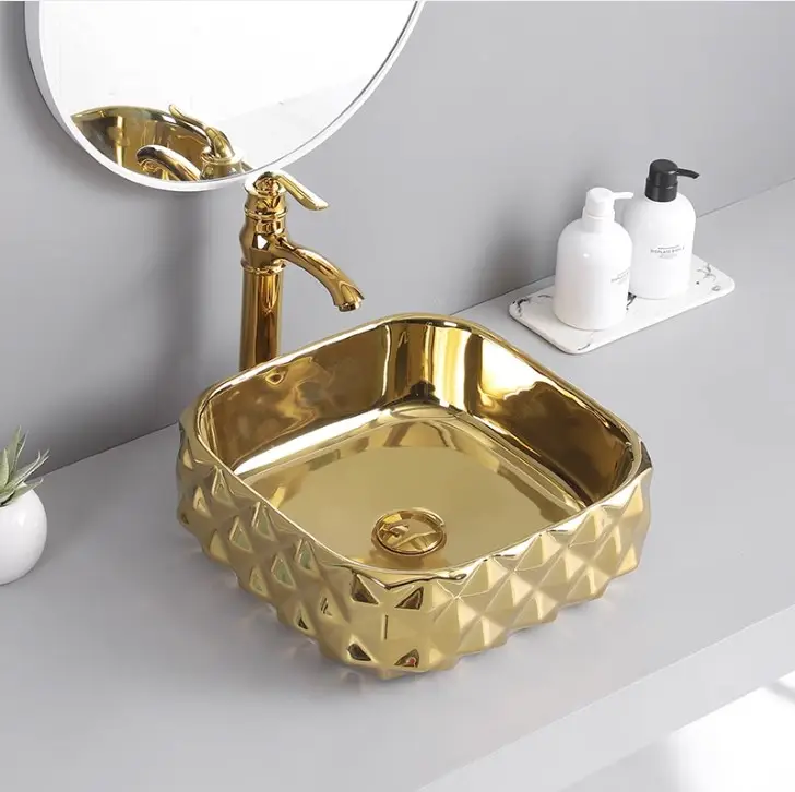 Sanitari in ceramica monopezzo color oro di lusso da tavolo lavabo da bagno lavabo artistico