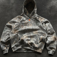 Sweat à capuche oversize en molleton bouclette avec imprimé camouflage Realtree feuilles sur toute la surface et logo brodé sur la poitrine, personnalisable par le fabricant