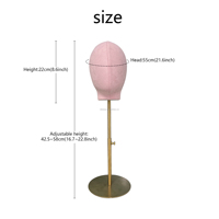 Tête de mannequin femme en fibre de verre rose de luxe avec pose debout pour la présentation visuelle en magasin