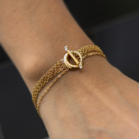 Bracelet Gaovo pour femme en acier inoxydable avec zircon, chaîne multicouche, fermoir OT, haut de gamme, en alliage or-titane 18 carats, inaltérable