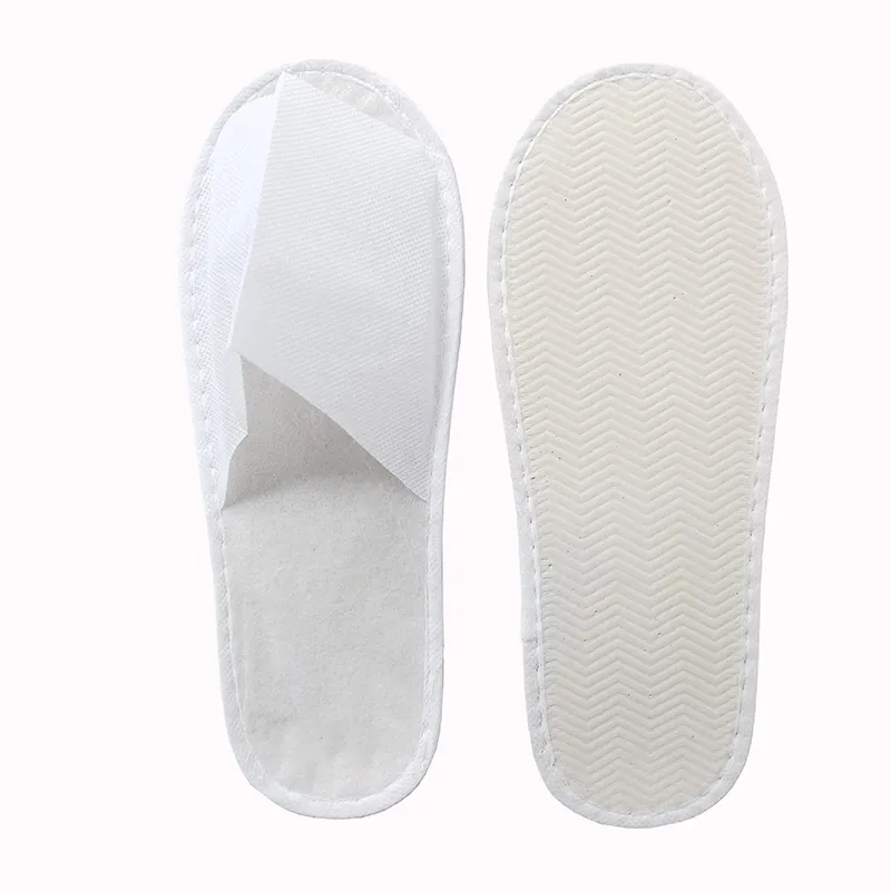 Disposable non woven slippers factory direct sales custom lightweight PP/SMS slippers for Spa and hotel use