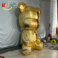 Sculpture géante gonflable en or métallique d'un ours assis, accessoire décoratif pour centre commercial de luxe