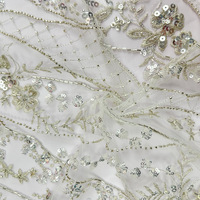 Tissu pour robe de mariée en dentelle brodée tube de perles à paillettes dorées pour la décoration de vêtements de performance