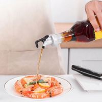 Bouteille d'huile anti-fuite avec bec verseur et bouchon à ouverture et fermeture automatiques