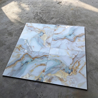 Carrelage en porcelaine effet marbre bleu doré brillant moderne 600x600 pour projets commerciaux et villas au Sénégal - Vente en gros