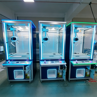 Machine à griffes UFO avec armoire à jouets à 3 modes de paiement, 30 styles disponibles pour parcs d'attractions