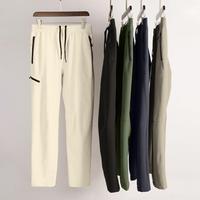 Vêtements de sport Pantalons de sport de gym pour hommes Pantalons cargo imperméables de couleur unie Pantalons maigres élégants Pantalons d'entraînement de fitness secs
