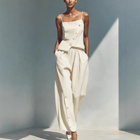 Nouvel ensemble d'été 2026 en lin asymétrique 2 pièces chic à la française avec camisole à boutons dorés et pantalon large bleu décontracté – Vente en gros