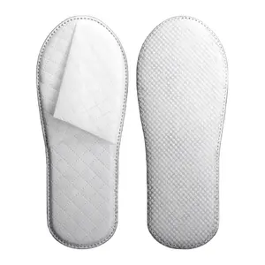 Zapatillas no tejidas con relieve blanco de hotel desechables de nuevo diseño para mujeres y hombres Zapatillas desechables de hotel