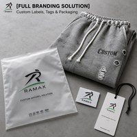Pantalon de survêtement unisexe personnalisé 100% coton gris chiné, style urbain, avec taille élastiquée froncée, cordon de serrage à gros pompons et effet multi-déchiré