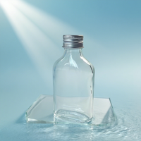 Botella plana de vidrio con logotipo personalizado de 200ml en forma de cilindro con tapa de rosca para envasar café frío o agua en estado vacío