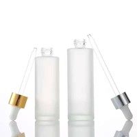 20ml 30ml 50ml 60ml 100ml Flacon compte-gouttes transparent d'essence de sérum pour les soins de la peau Flacon rond en verre transparent mat avec compte-gouttes blanc