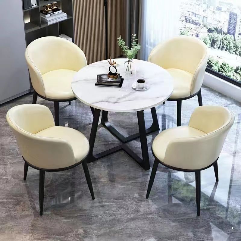 1 table pieds noirs+4 chaises cuir blanc