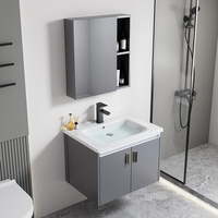 Ensemble de salle de bain moderne de luxe léger en aluminium avec vasque en céramique grise en pierre frittée, miroir LED et armoire murale pour hôtel et villa
