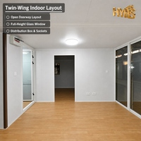 Maison conteneur moderne personnalisée à 2 chambres, pliable et extensible, avec structure en acier blanc, porte coulissante en verre isolant, cuisine intégrée pour ADU de jardin