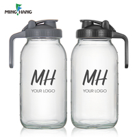 Prix d'usine – Pichet en verre transparent de 2 L (64 oz) avec poignée et couvercle à clapet pour boissons aux fruits