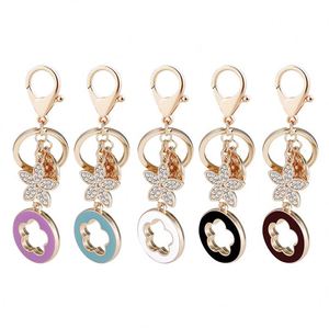 Nouveau porte-clés de voiture en alliage avec strass et motif trèfle à cinq feuilles porte-bonheur, pendentif créatif, cadeau - Product Image 5
