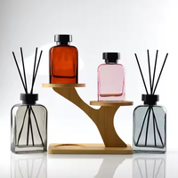 Diffuseur de parfum personnalisé 200 ml en verre de luxe en forme de bouteille avec estampage doré et bouchon à vis sérigraphié