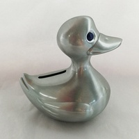 Tirelire en alliage de zinc plaqué étain en forme de canard métallique