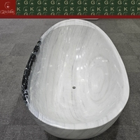 Baignoire ovale autoportante en marbre blanc Panda GOLDKING, design contemporain, veinure noire audacieuse, polissage CNC OEM, sur mesure