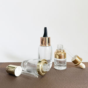 Bouteilles d'huile de croissance des cheveux épaule plate 50ml verre Push Press flacon compte-gouttes capuchon en or rose avec <span class=keywords><strong>bouton</strong></span> poussoir - Product Image 1