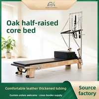 Reformador de Pilates de doble uso de roble con media torre y tabla de salto para sesiones de entrenamiento en pareja y fitness en sala