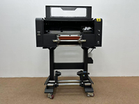 Meilleure Vente : Machine d'impression d'autocollants UV DTF 30 cm avec têtes XP600 TX800, imprimante de transfert de film cristal et laminateur automatique