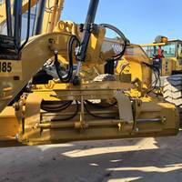 Niveleuse routière Caterpillar 140H d'occasion, modèle Cat 140M, en excellent état de marche, idéale pour le nivellement des terrains et les projets routiers.
