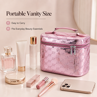 Sac cosmétique personnalisé en gros avec logo, finition métallique rose, motif gaufré, double fermeture éclair, trousse de maquillage portable