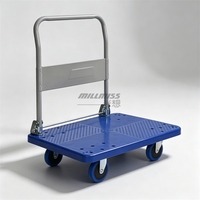 Chariot à plateau plat en plastique industriel à quatre roues pour la manutention et le déplacement des marchandises en entrepôt et en usine