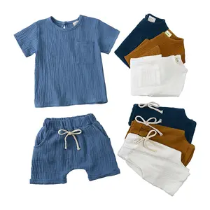 סיטונאי OEM 100% כותנה מוסלין ילד פעוט בגדי סטים רך קצר שרוול קצר חולצה סט שתי חתיכה קיץ תינוק ילד בגדים