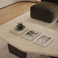 Table basse ovale de style français et italien, design moderne inspiré de la pierre des grottes anciennes, pour espaces calmes, salon, salle de thé